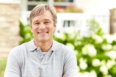 Smiling man outdoors_GettyImages-174922045