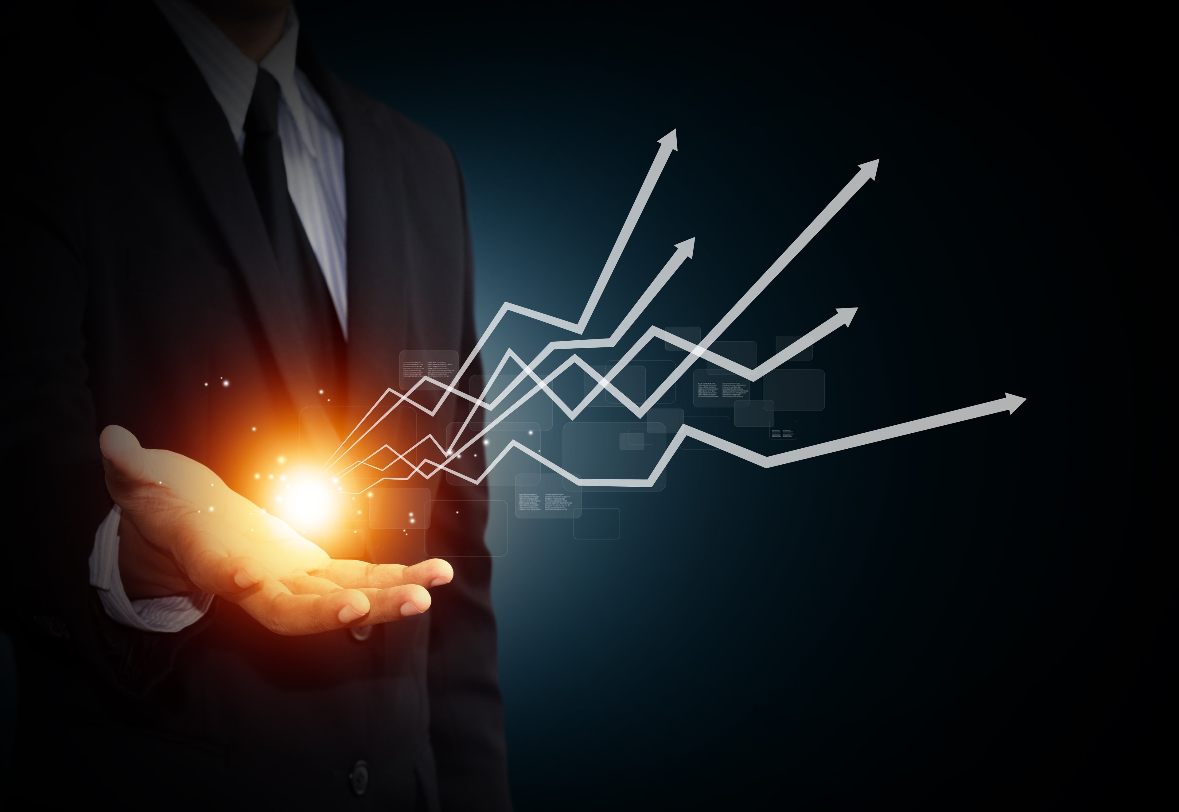 Upward moving arrows grow out of a business man's open hand.