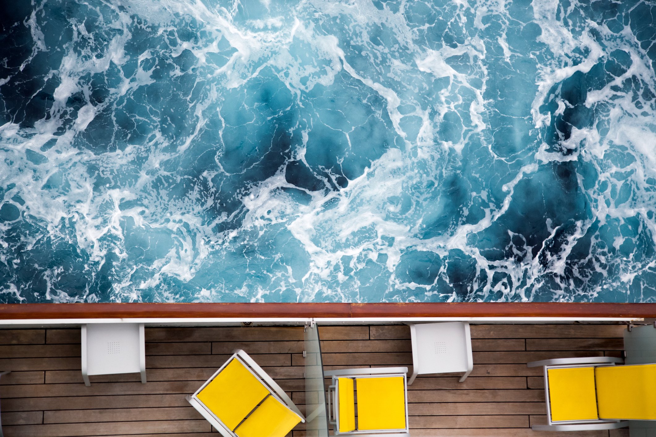 Rough water off the side of a cruise ship. 