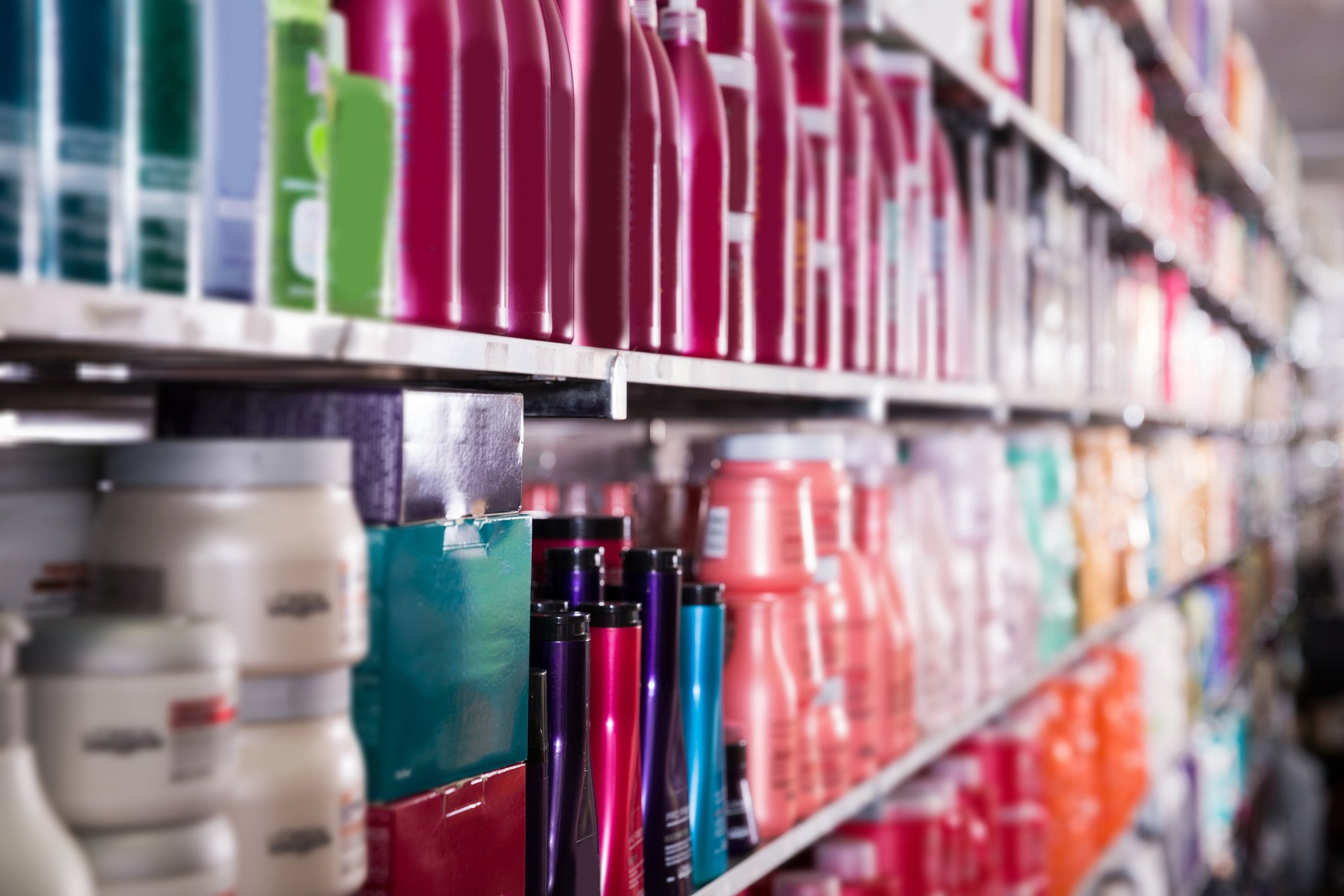 A store shelf with various hair care products.