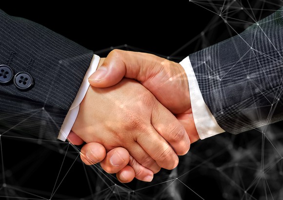 Two businessmen shaking hands.