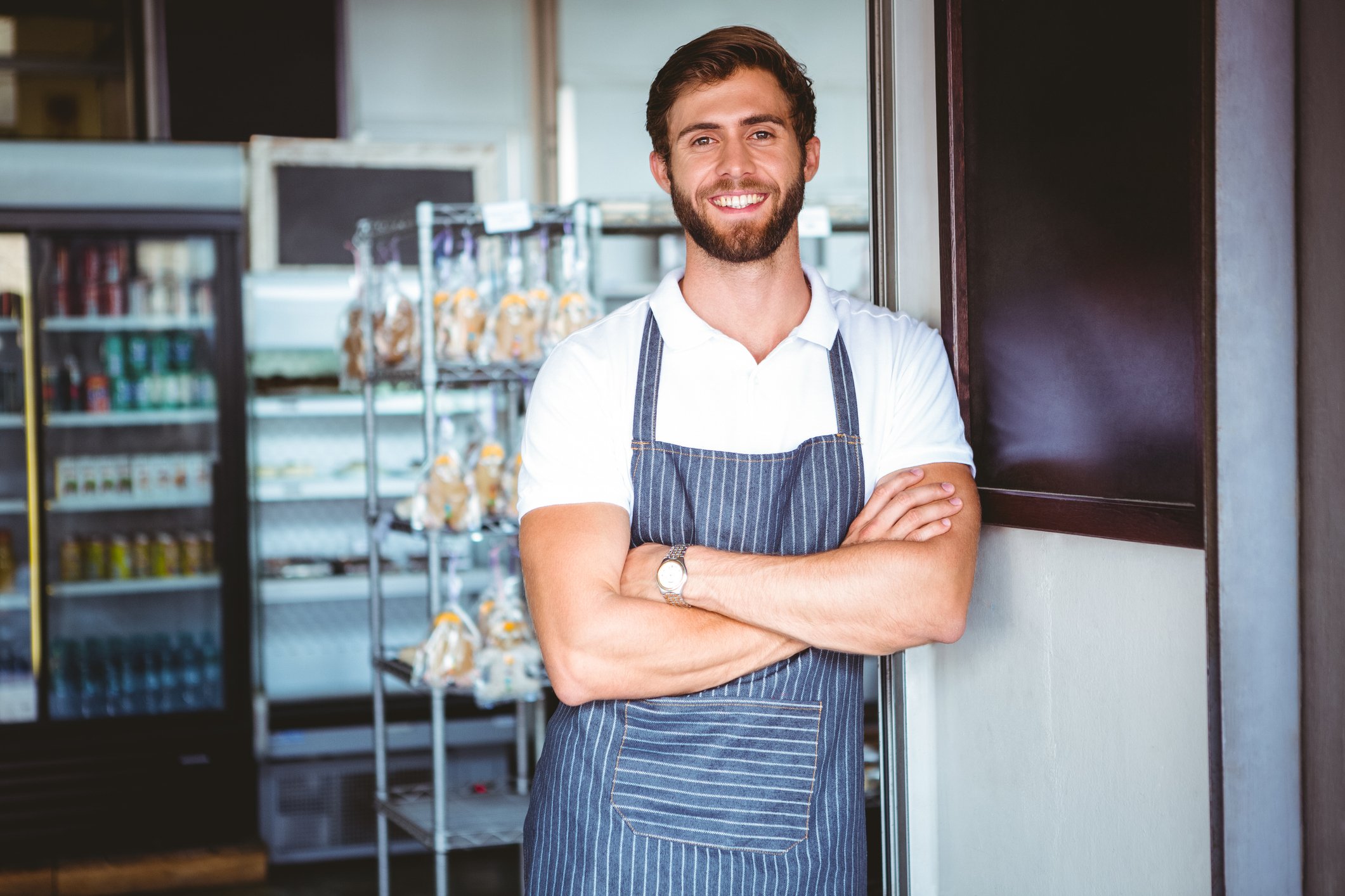 Smiling man wearing apron