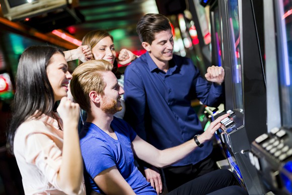 friends playing arcade games