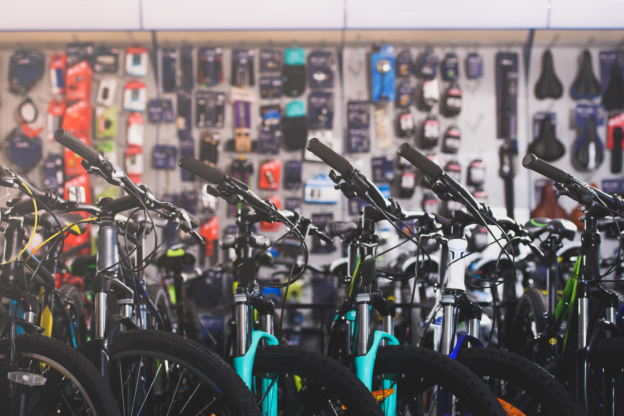 A line of bicycles in a sporting goods store.