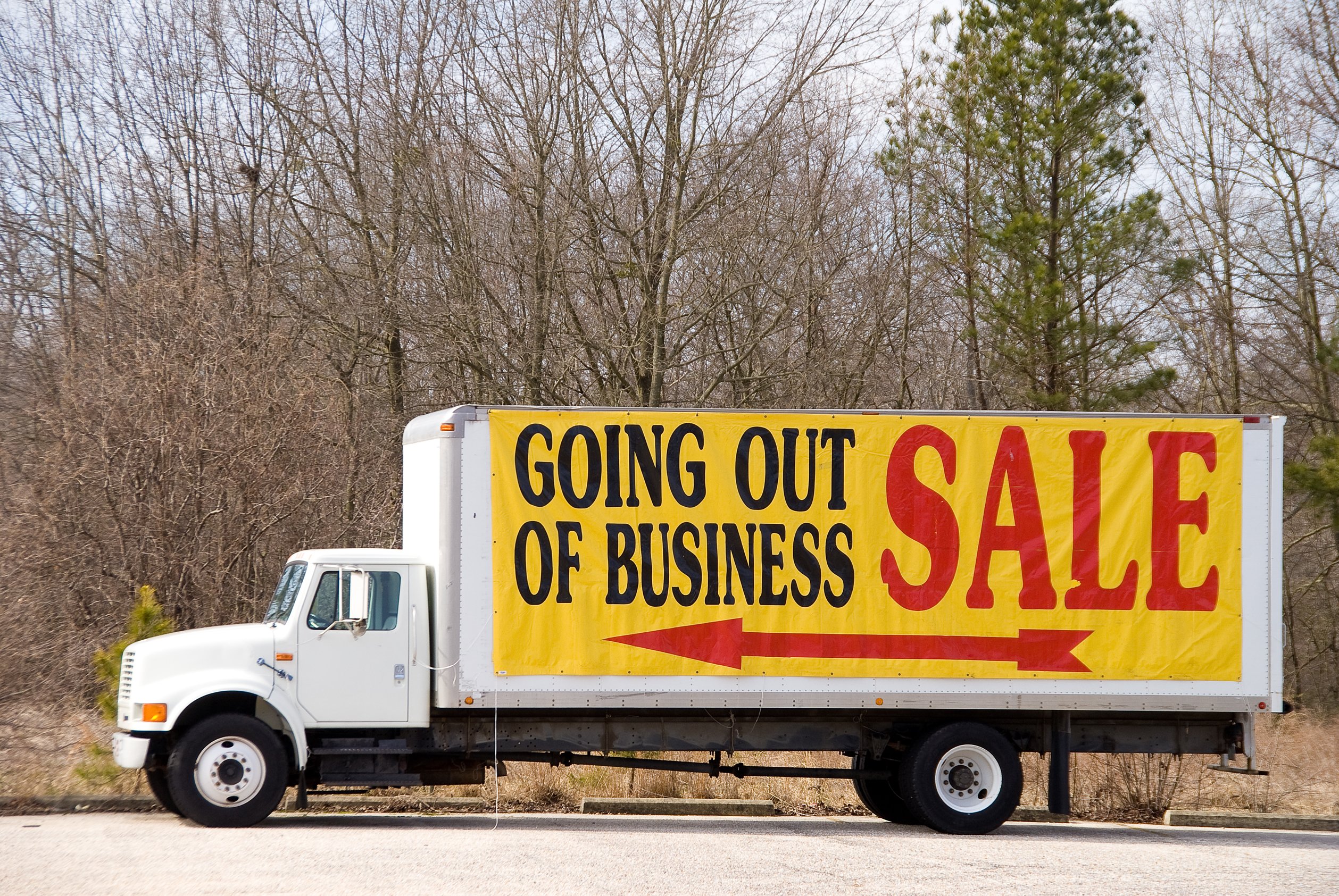 "Going out of business sale" sign on a truck.