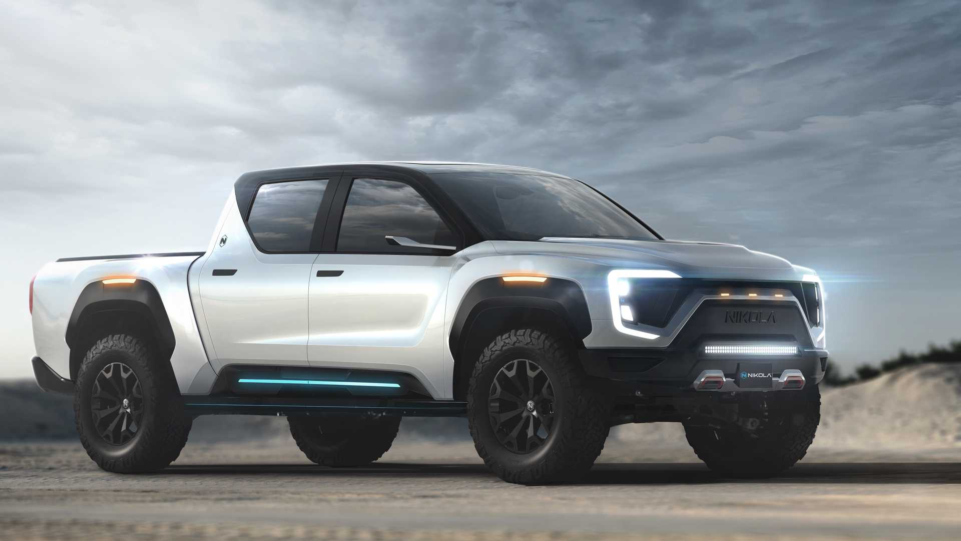 The Nikola Badger pickup truck concept vehicle is shown sitting on a roadway under cloudy skies