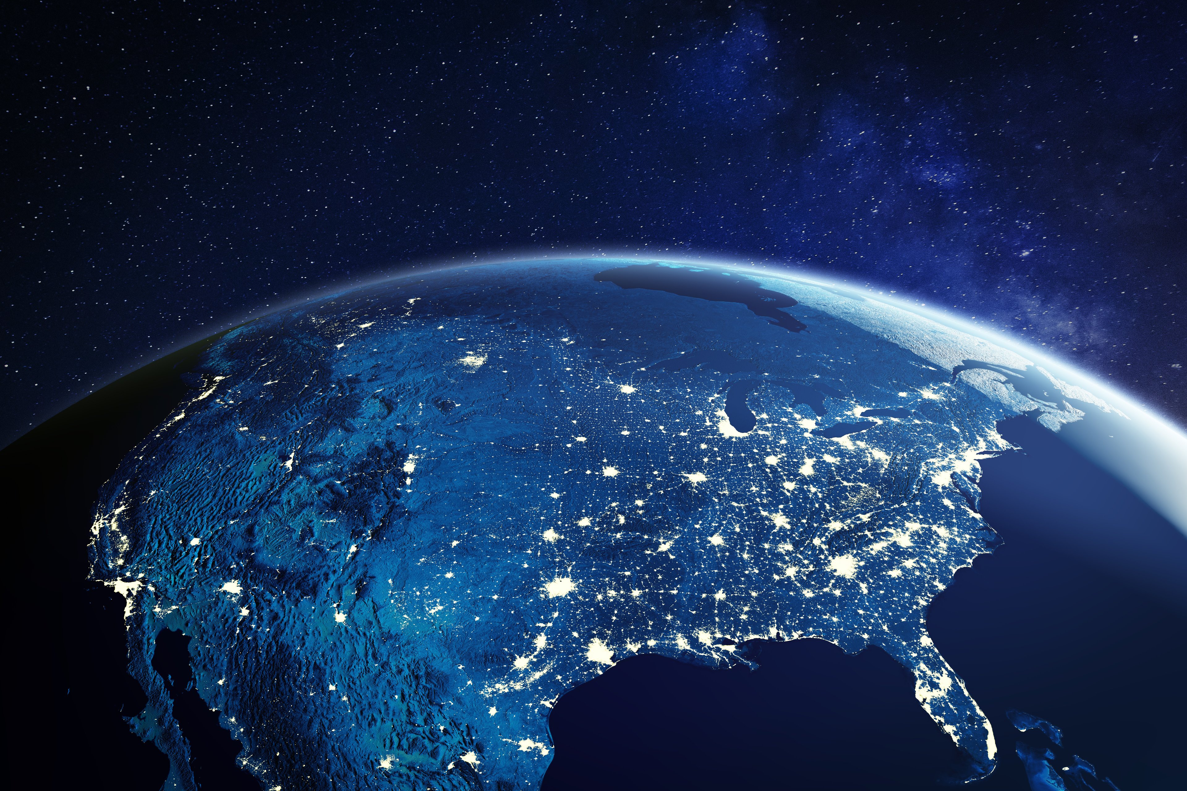 Photo of the U.S. at night from space, showing lit-up cities and roads