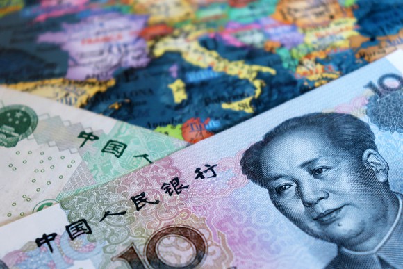 Chinese currency on a map of Europe. 