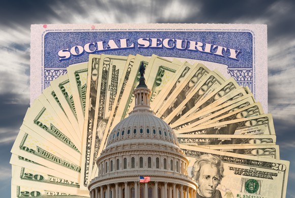 Social Security card above $20 bills fanned out with the U.S. Capitol building in the foreground