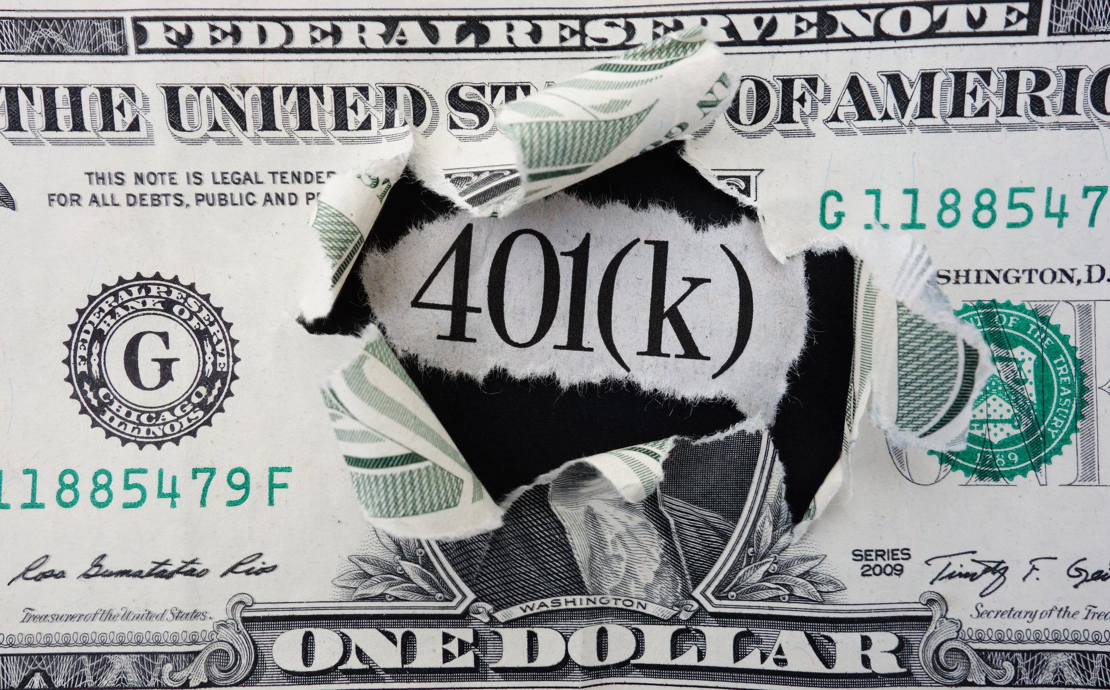 Words 401(K) popping through a one dollar bill.