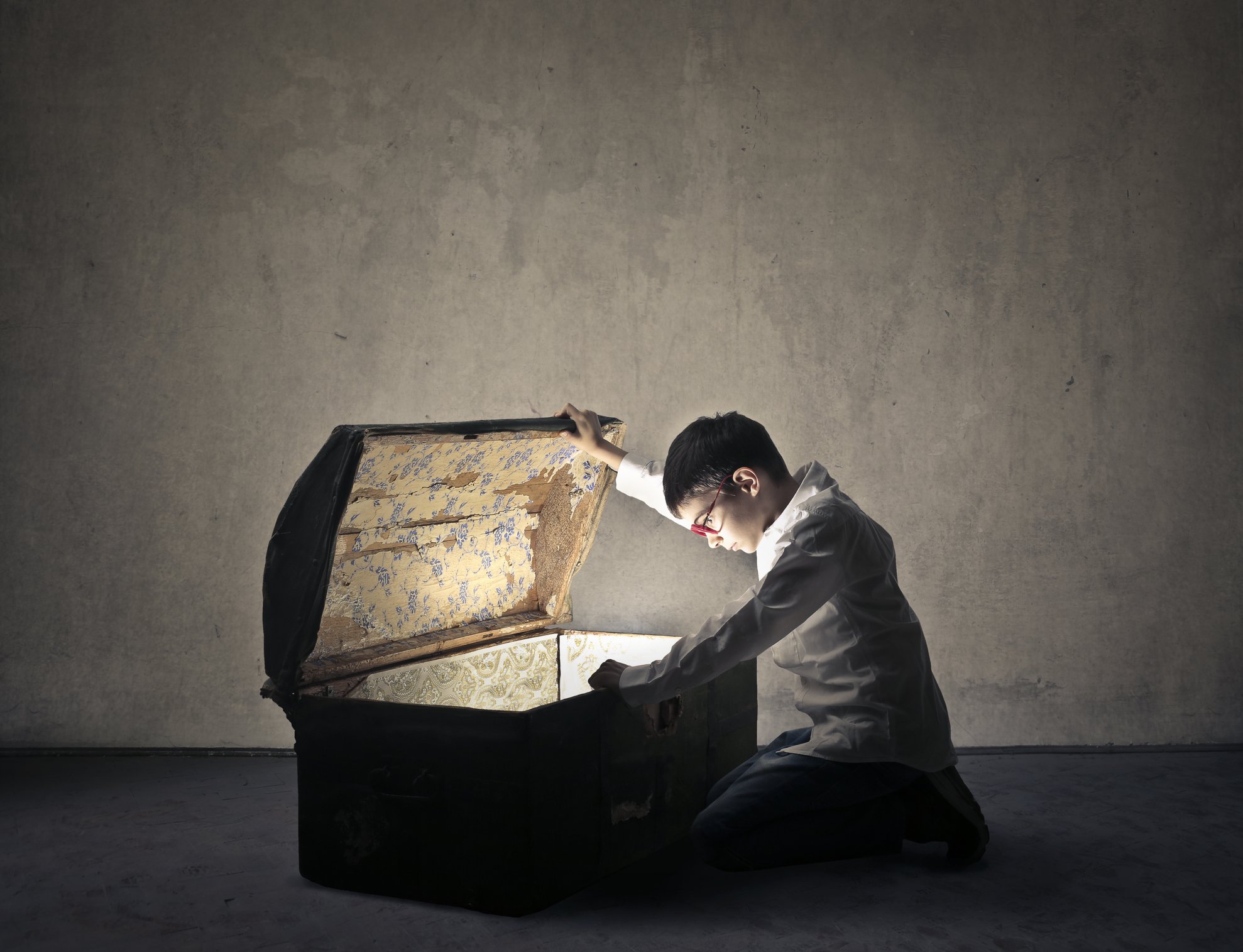 A person opening up a box of treasure.