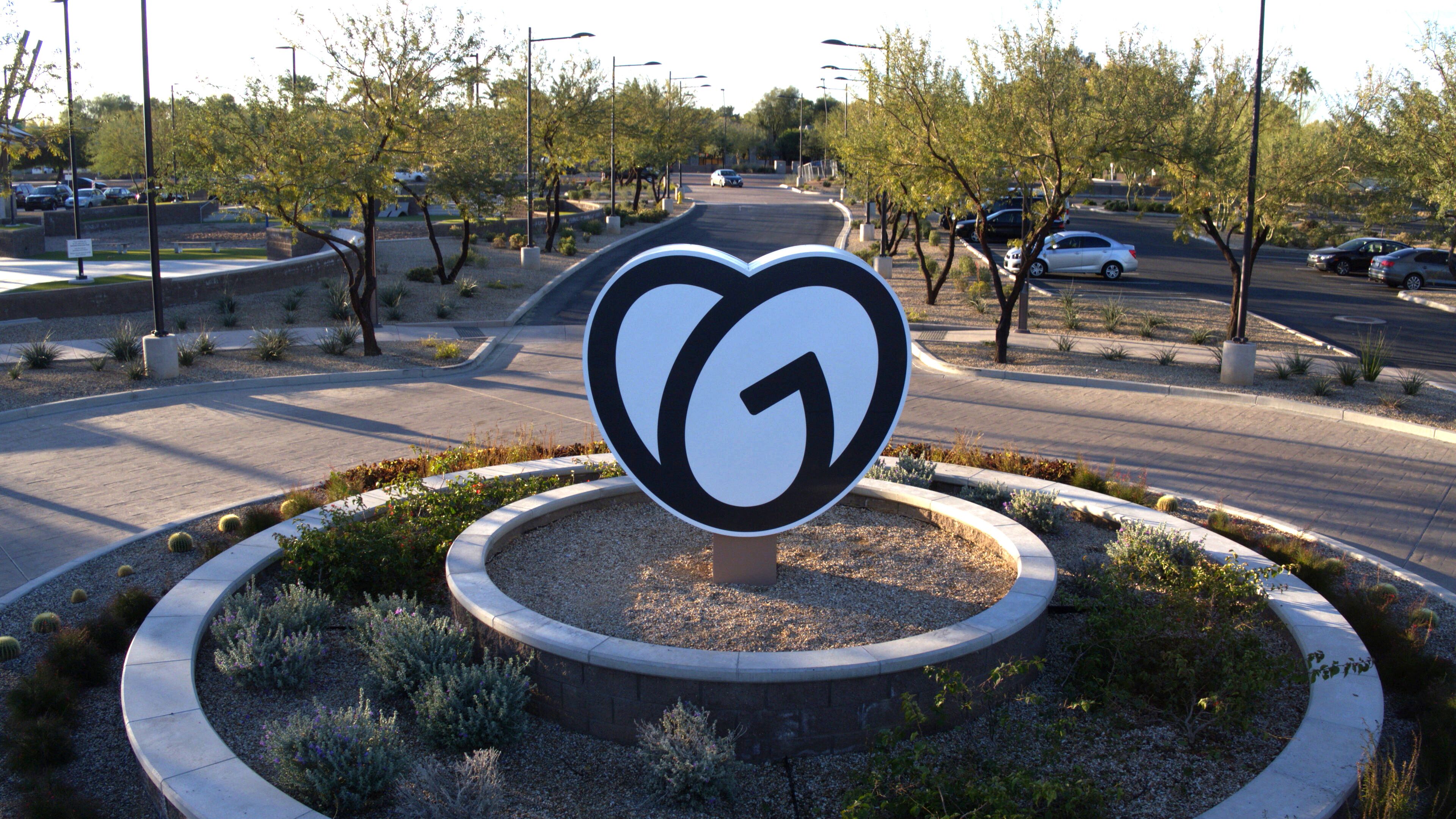 GoDaddy logo sign in the middle of a cul de sac front of Tempe office