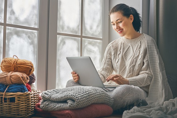 Woman using laptop computer.