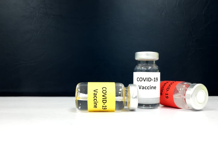 Several vials labeled COVID-19 Vaccine