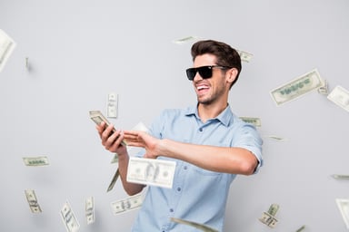 Man throwing money away