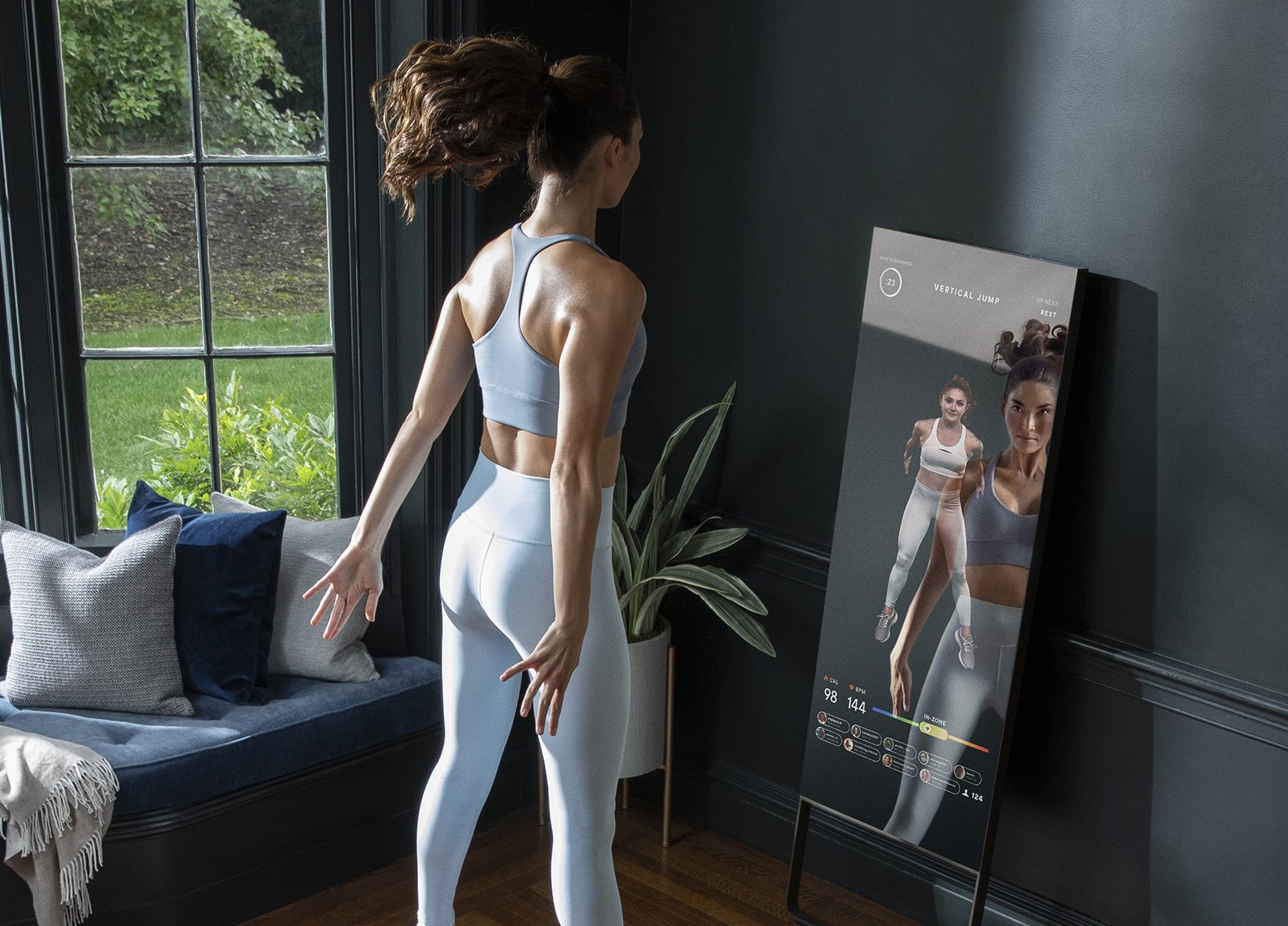 Woman exercising to a MIRROR class.