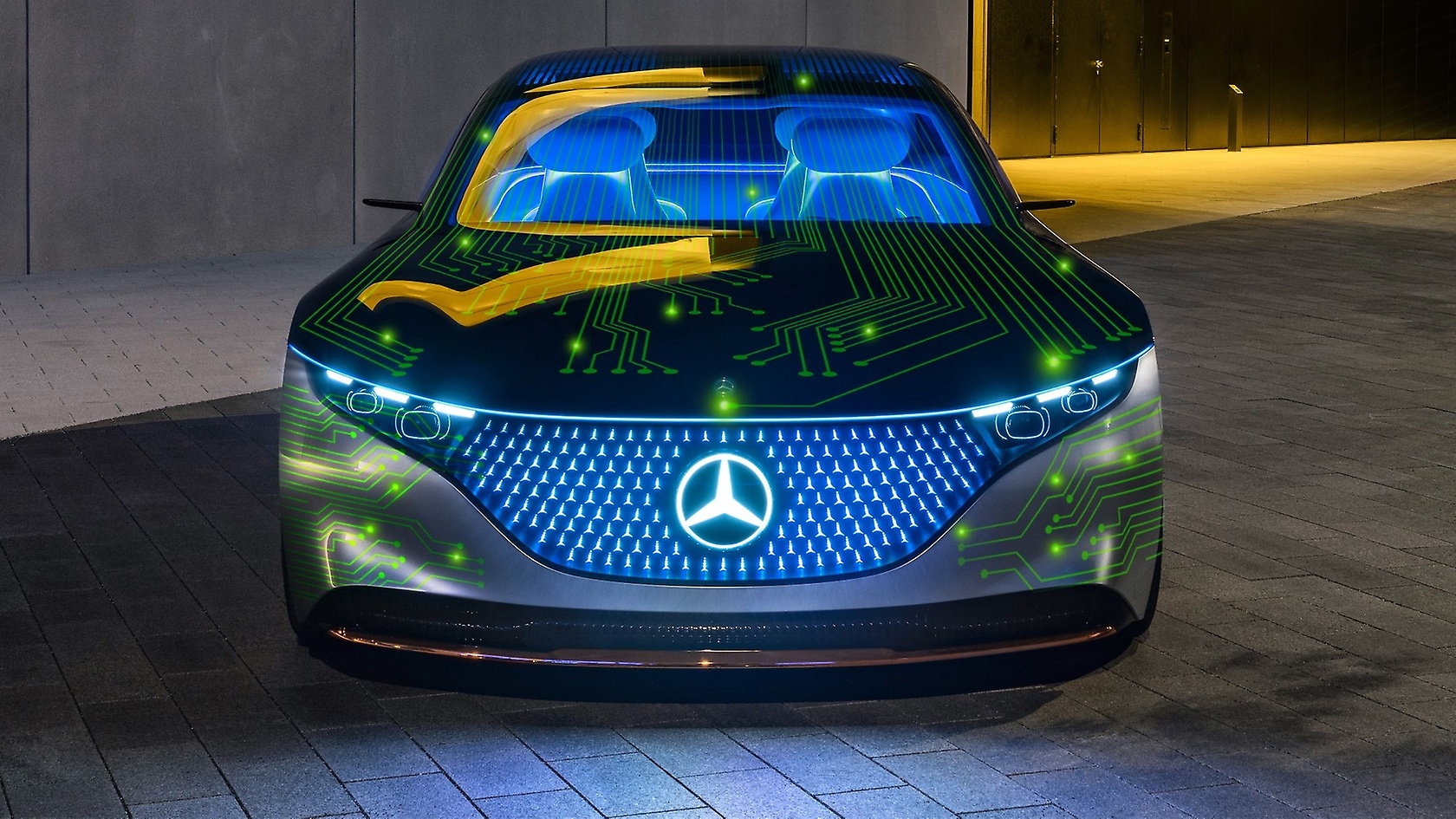 A Mercedes-Benz car covered with bright green computer circuit lines.