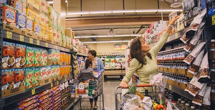 Two women shop in a Grocery Outlet location.