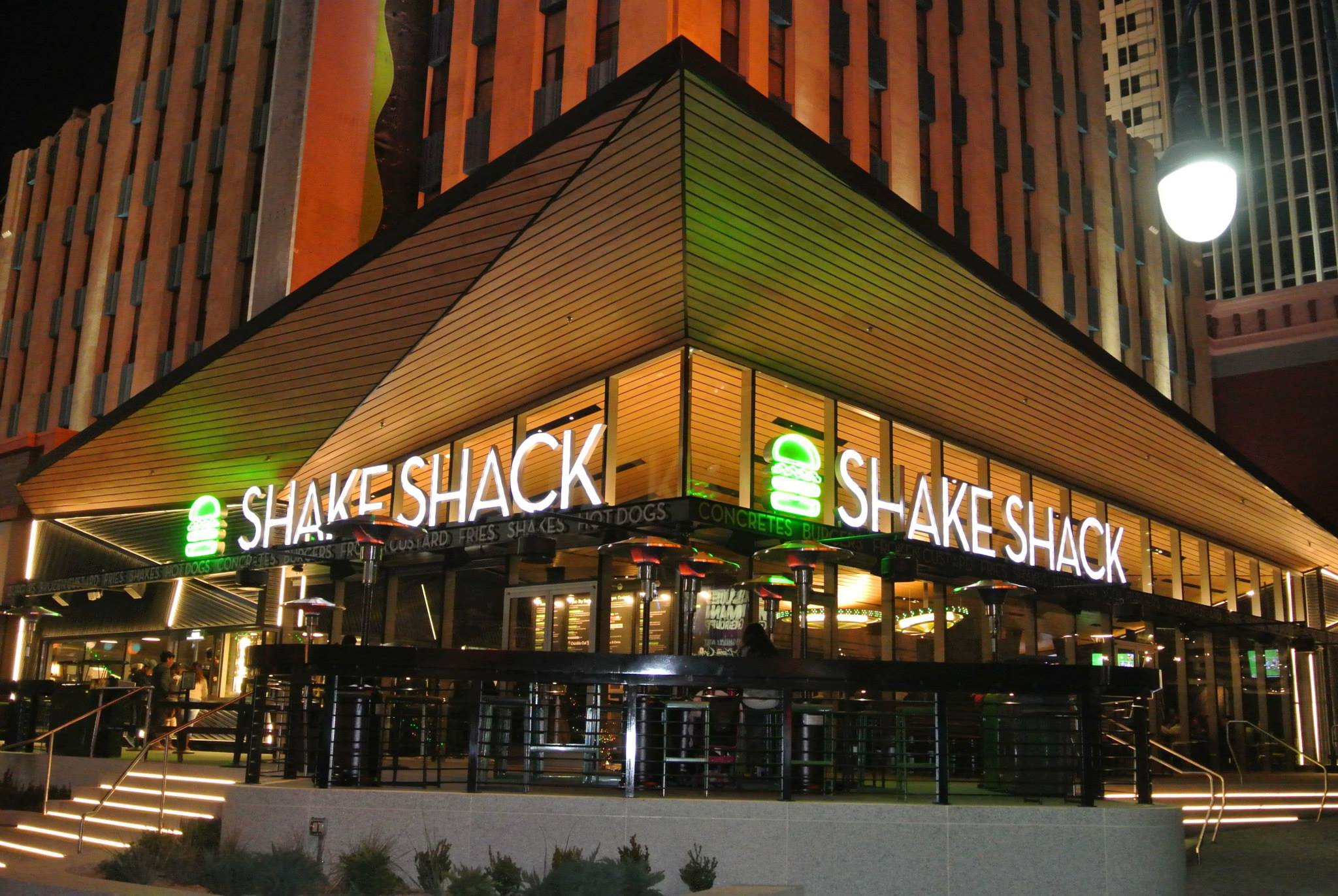 Shake Shack restaurant exterior at night.