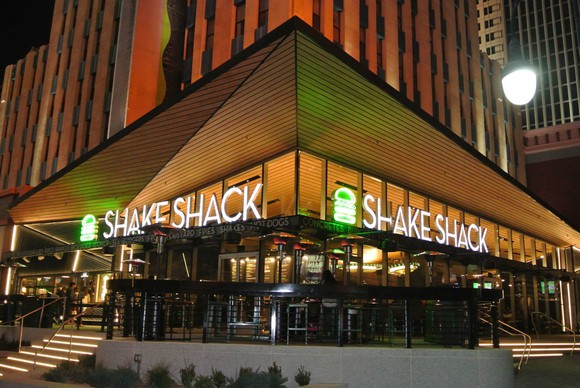 Shake Shack restaurant exterior at night.