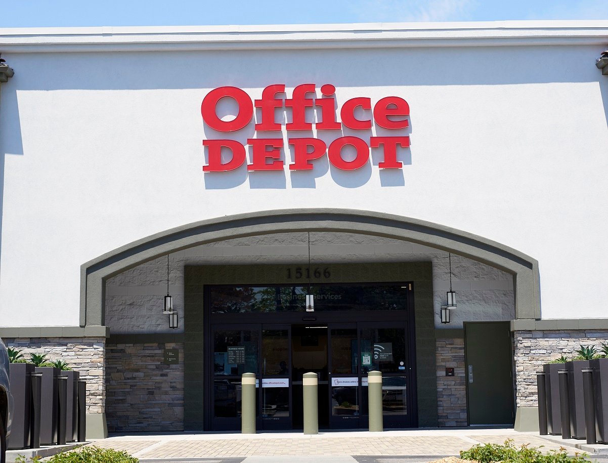 Outside entrance to Office Depot, with logo above the archway