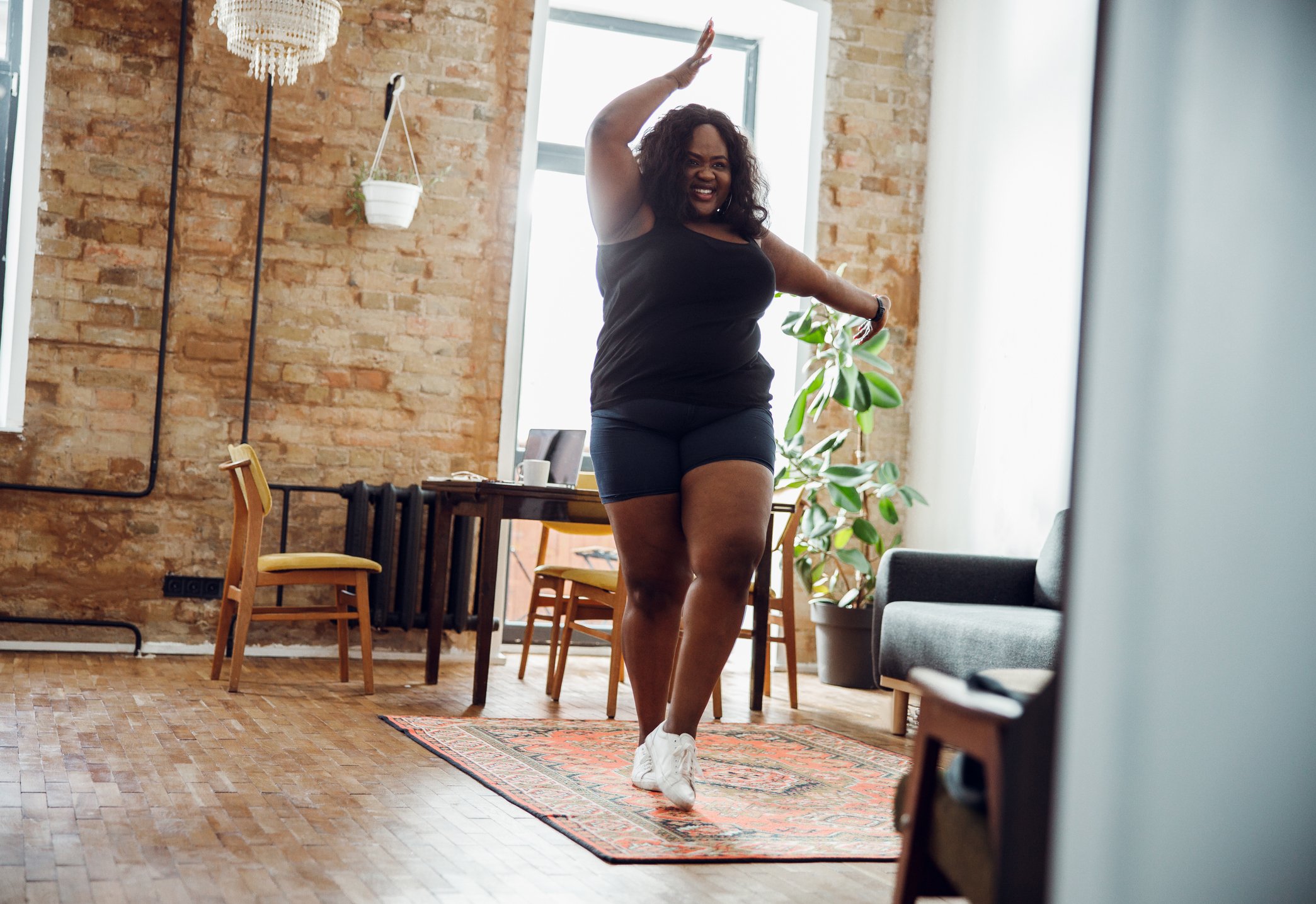A woman working out at home.