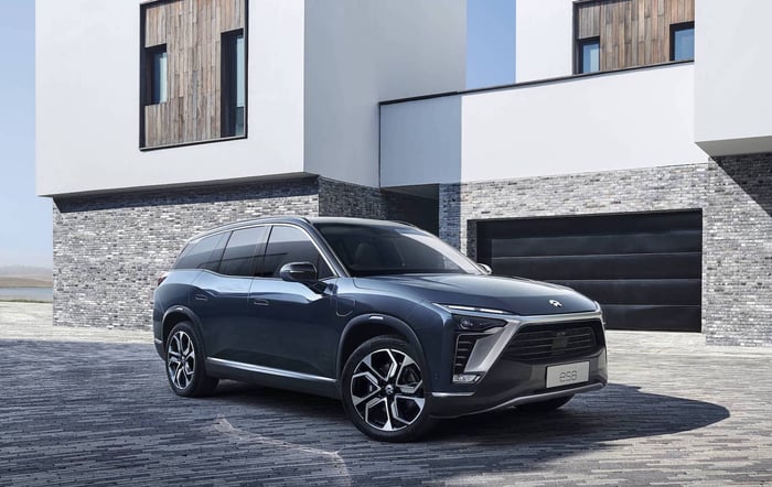 A blue NIO ES8, an upscale 7-passenger electric crossover SUV.