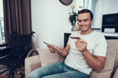 Man online shops_wheelchair in background