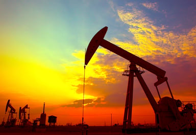 An oil pumping unit at sunset.