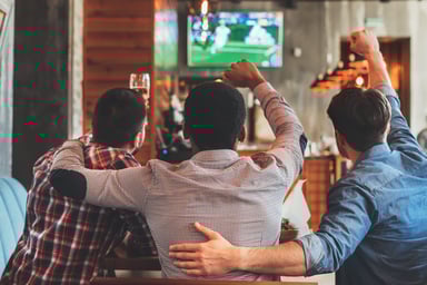 Men watching live sports on tv