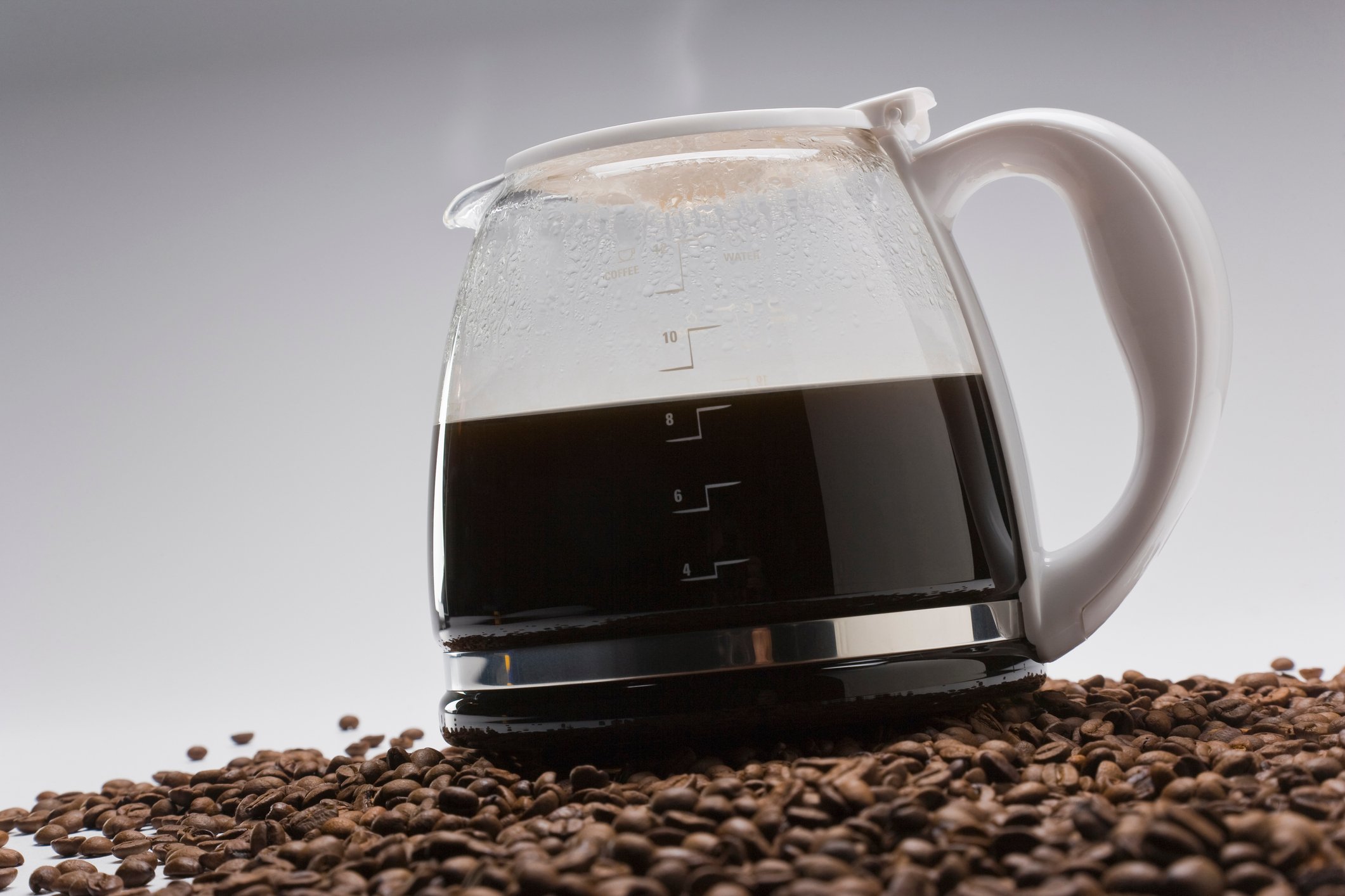 Coffee pot on top of coffee beans