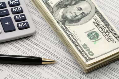 Dividend Cash on Financial Newspaper Getty