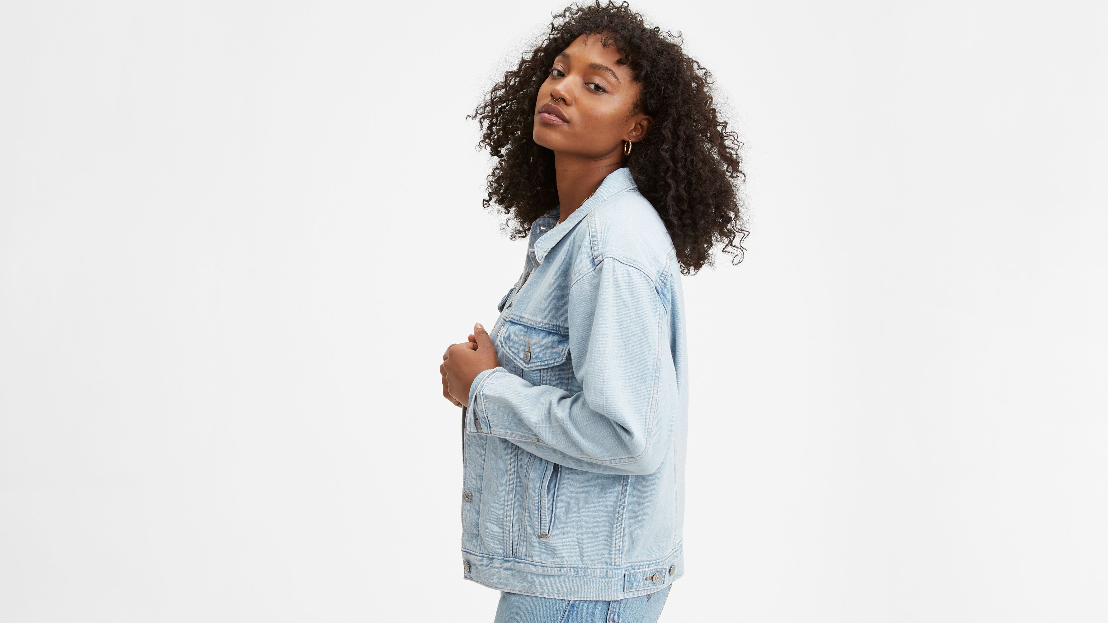 Woman modeling a Levi's jean jacket.