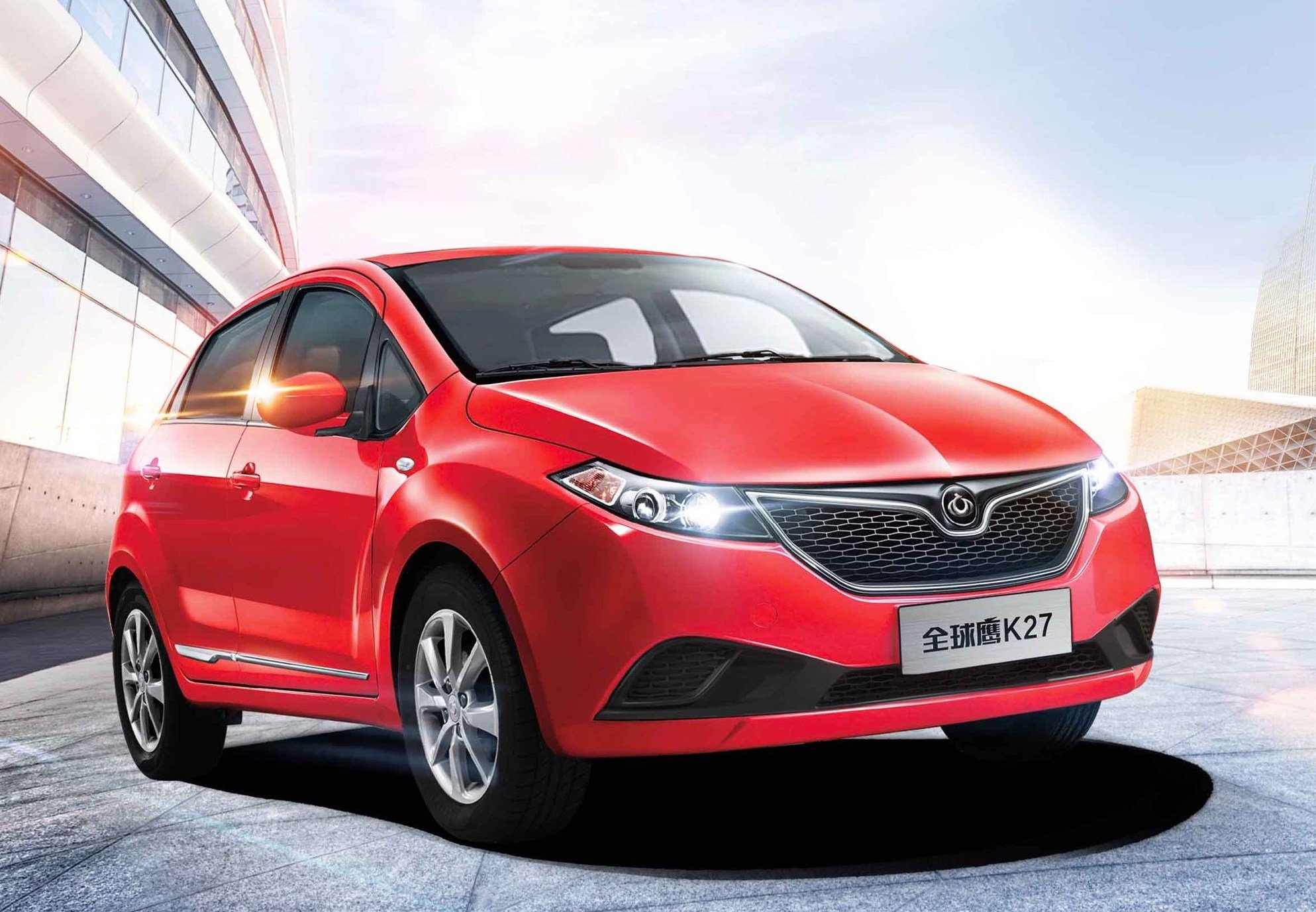 A red Kandi K27, a small electric hatchback.