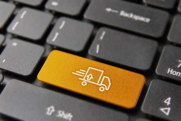 A computer keyboard with a delivery truck pictured on one key.