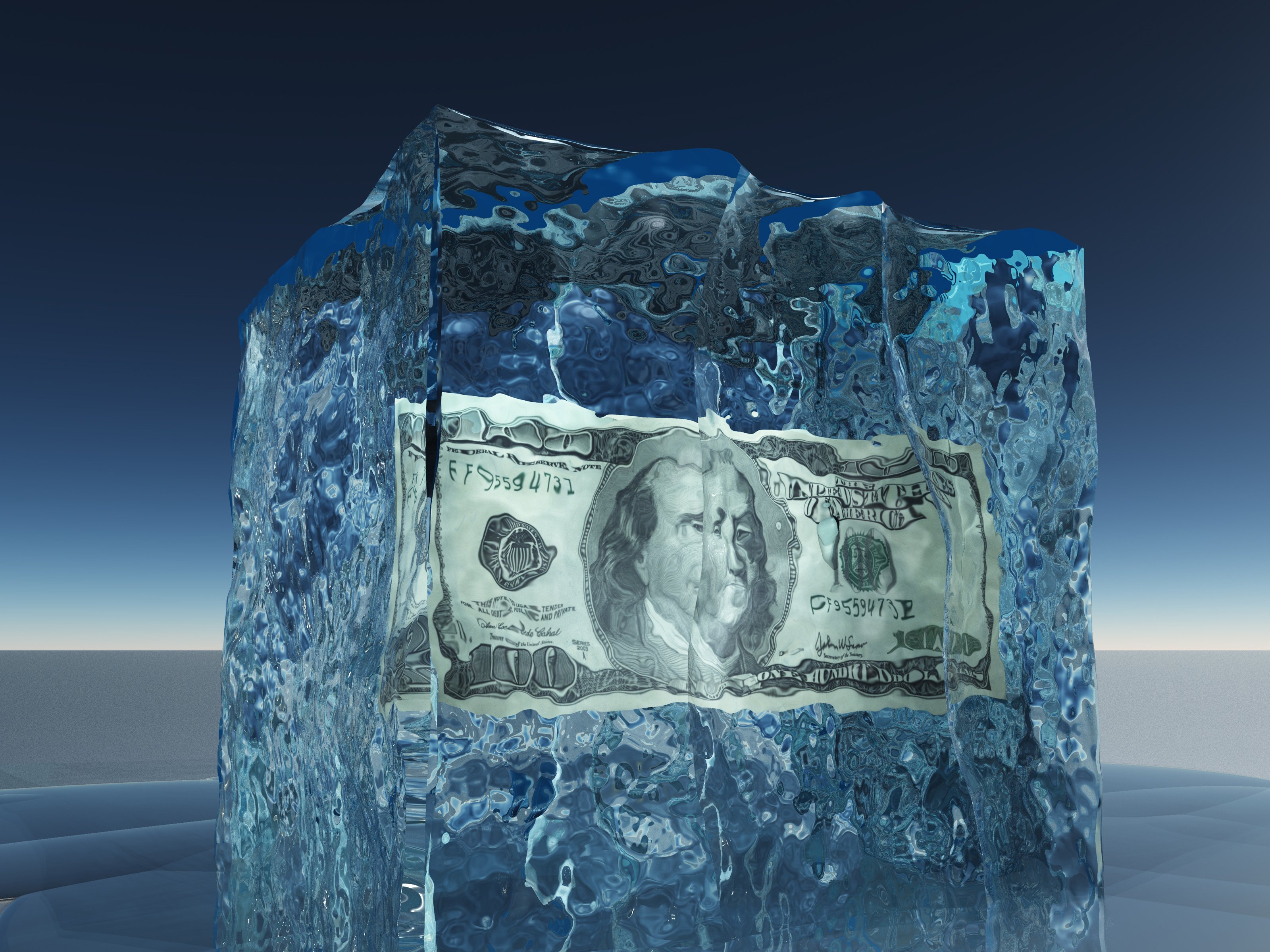 A hundred-dollar bill encased in a large ice block.