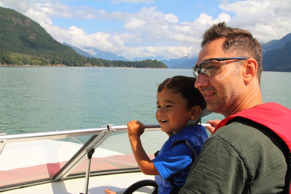 Father and son on a boat.