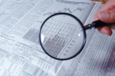 Searching for Stocks With Magnifying Glass Getty