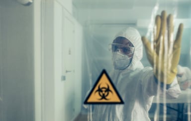 Scientist with hand up in restricted area