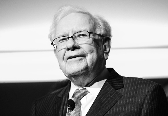 a black and white photograph of Warren Buffett