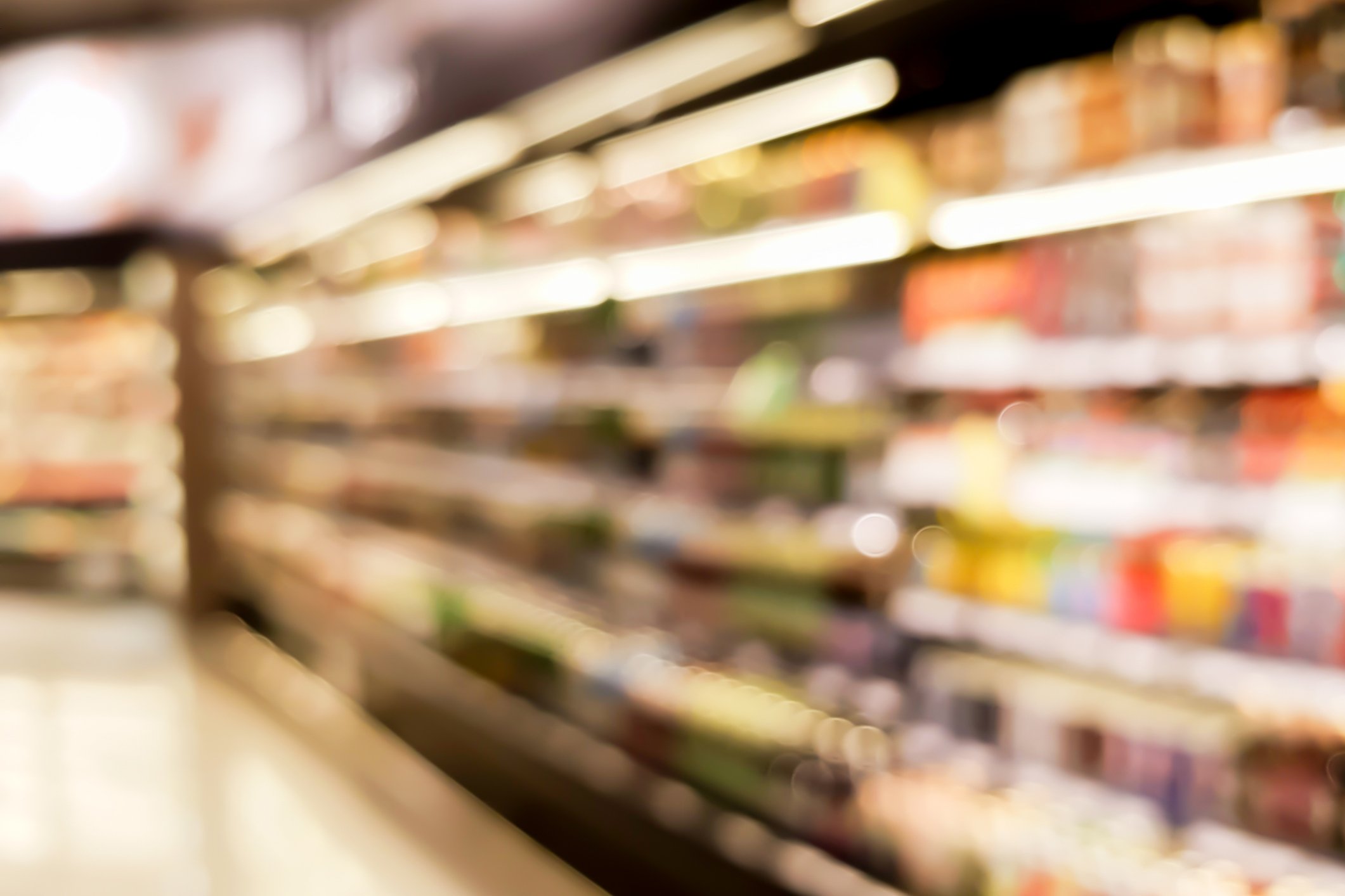 A blurred view of a supermarket aisle.