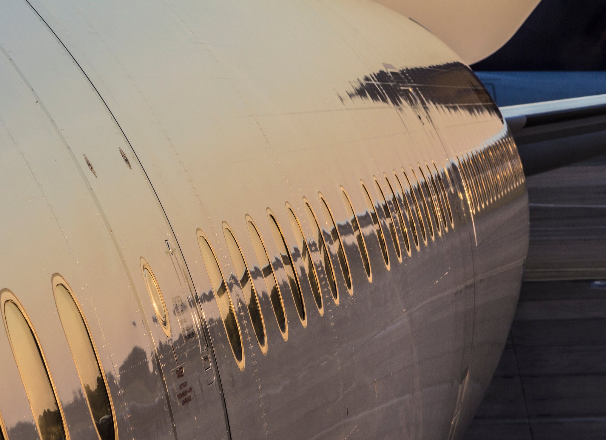 Close up side view of a commercial airplane.