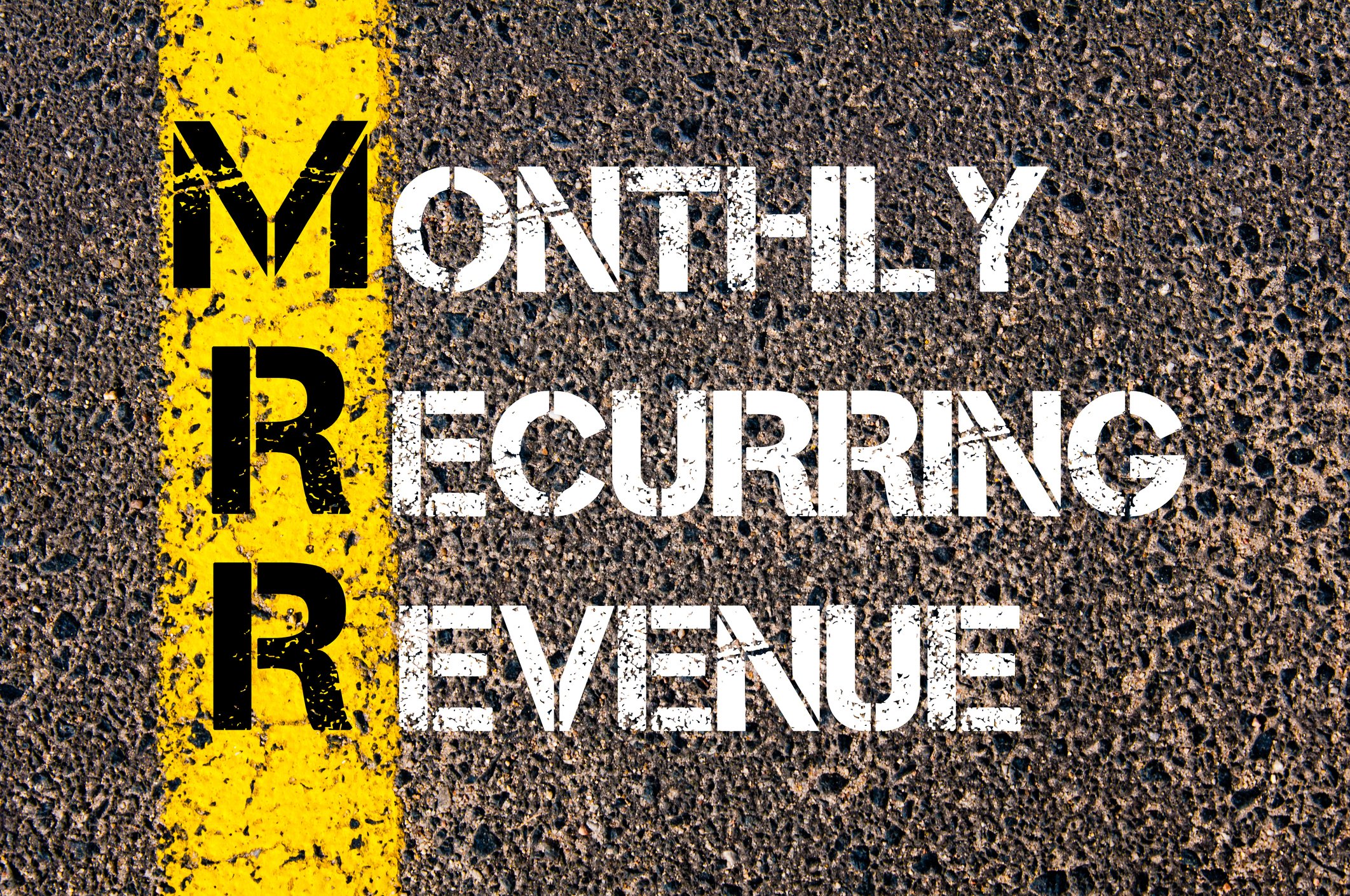 The words monthly recurring revenue are painted on pavement.
