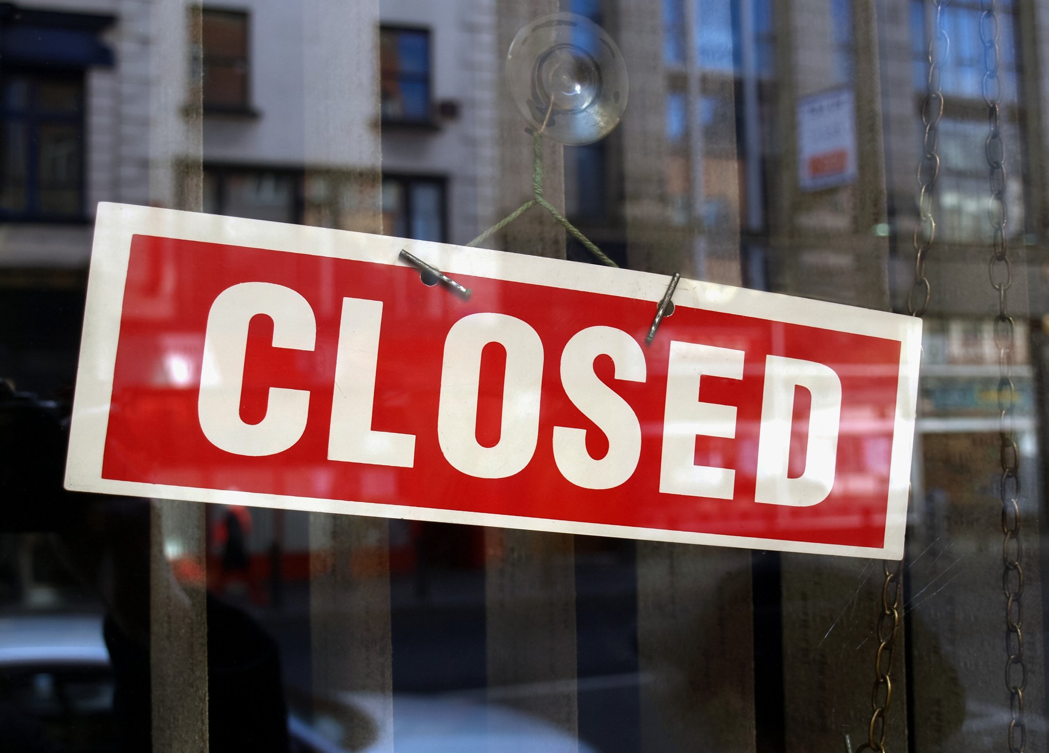A closed sign in a shop window.