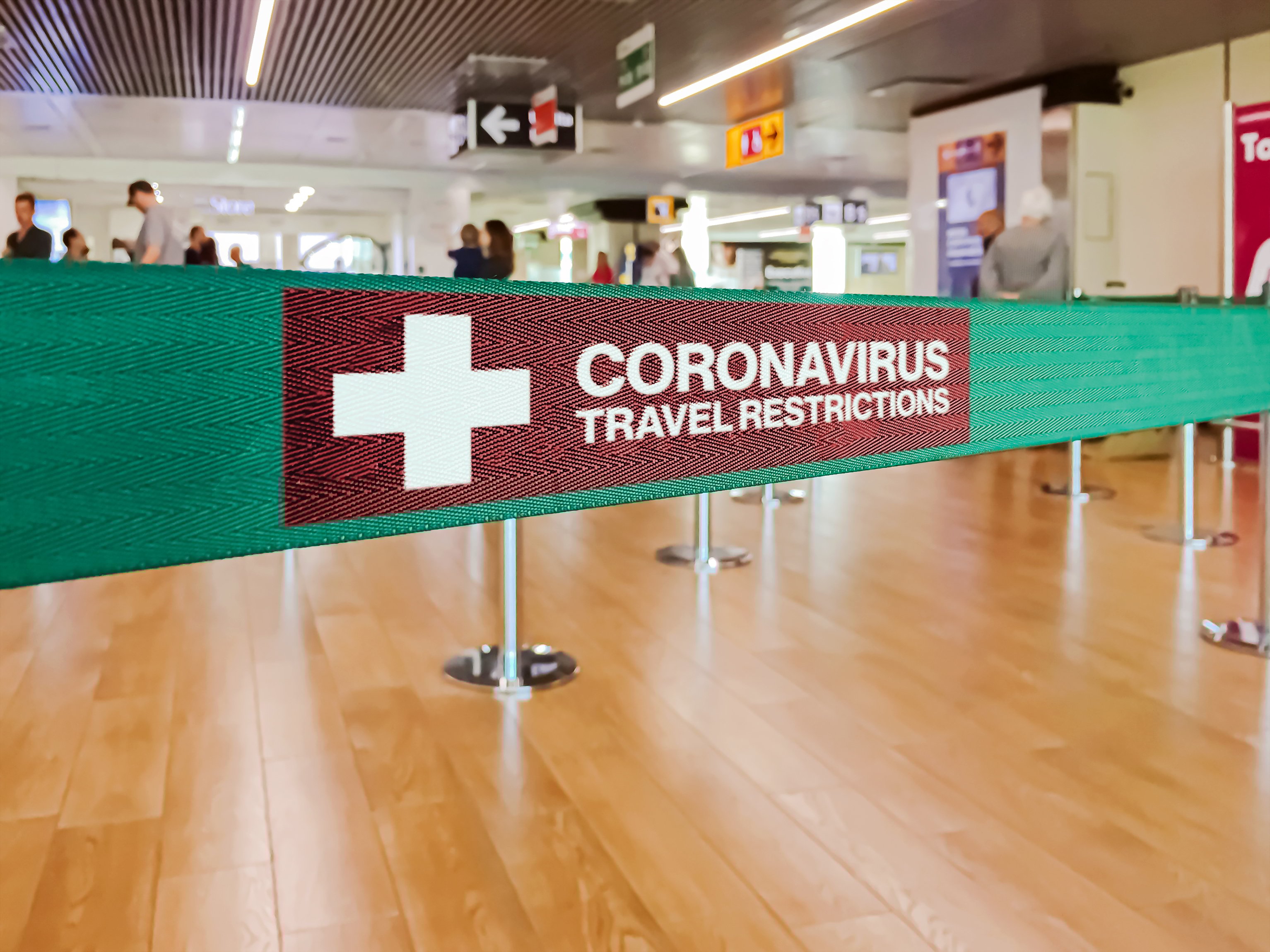 Sign that says "Coronavirus travel restrictions"