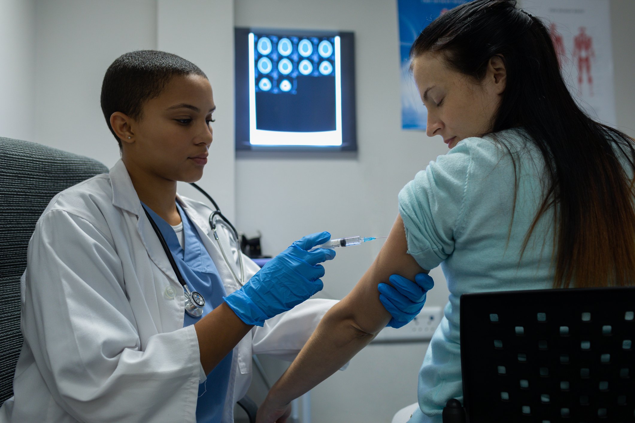 Patient receiving an injection from a doctor
