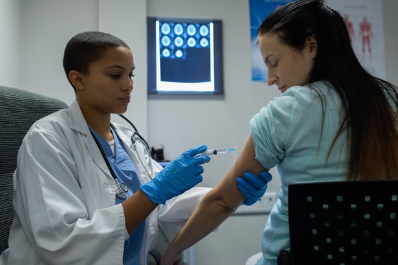 Patient receiving an injection from a doctor