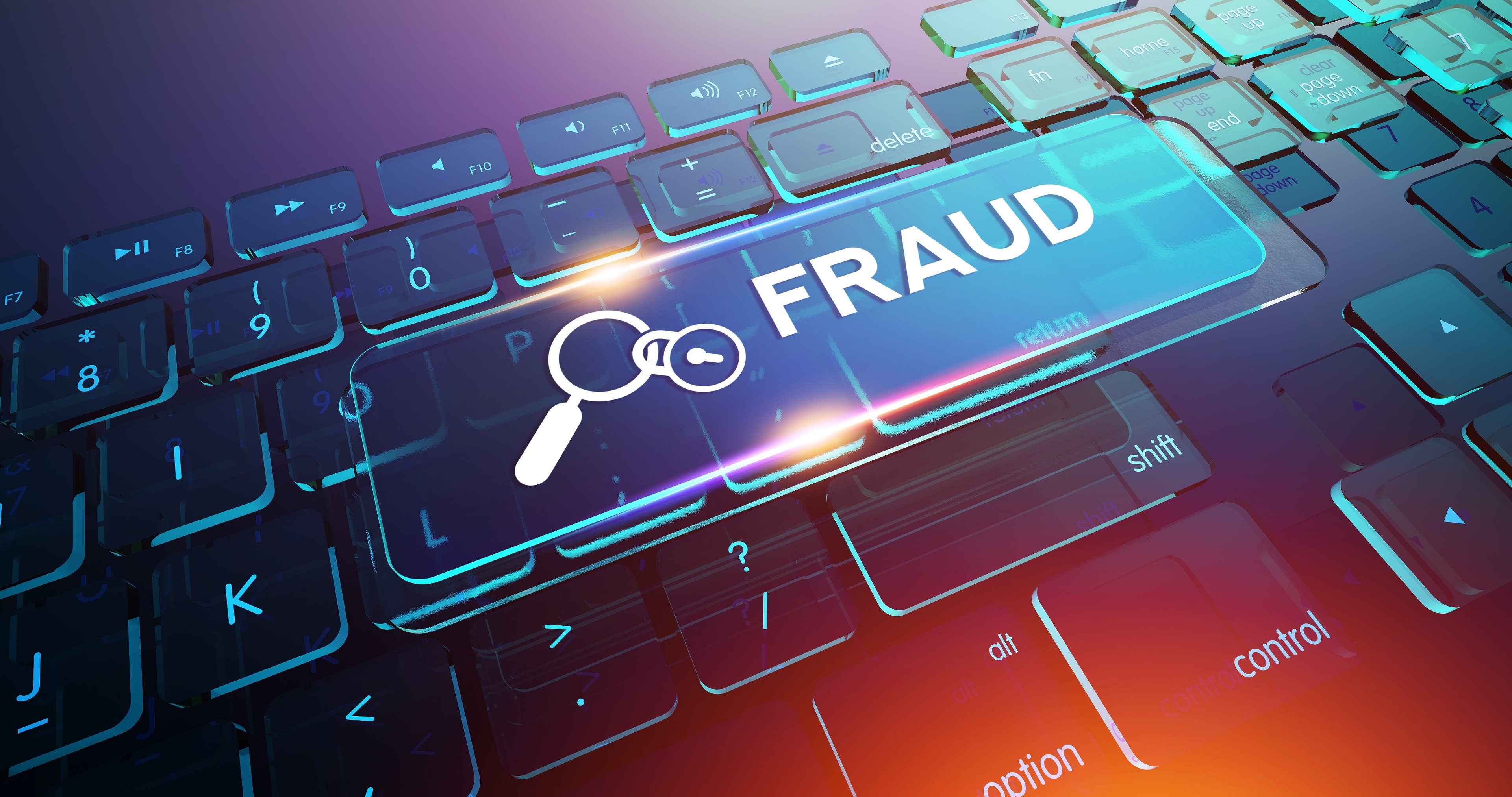 The word fraud with a keyboard in the background.