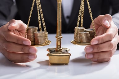 scales wtih coins on them