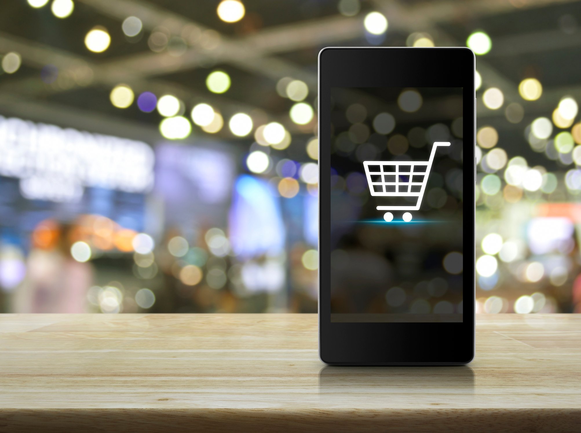 A shopping cart icon on a smartphone